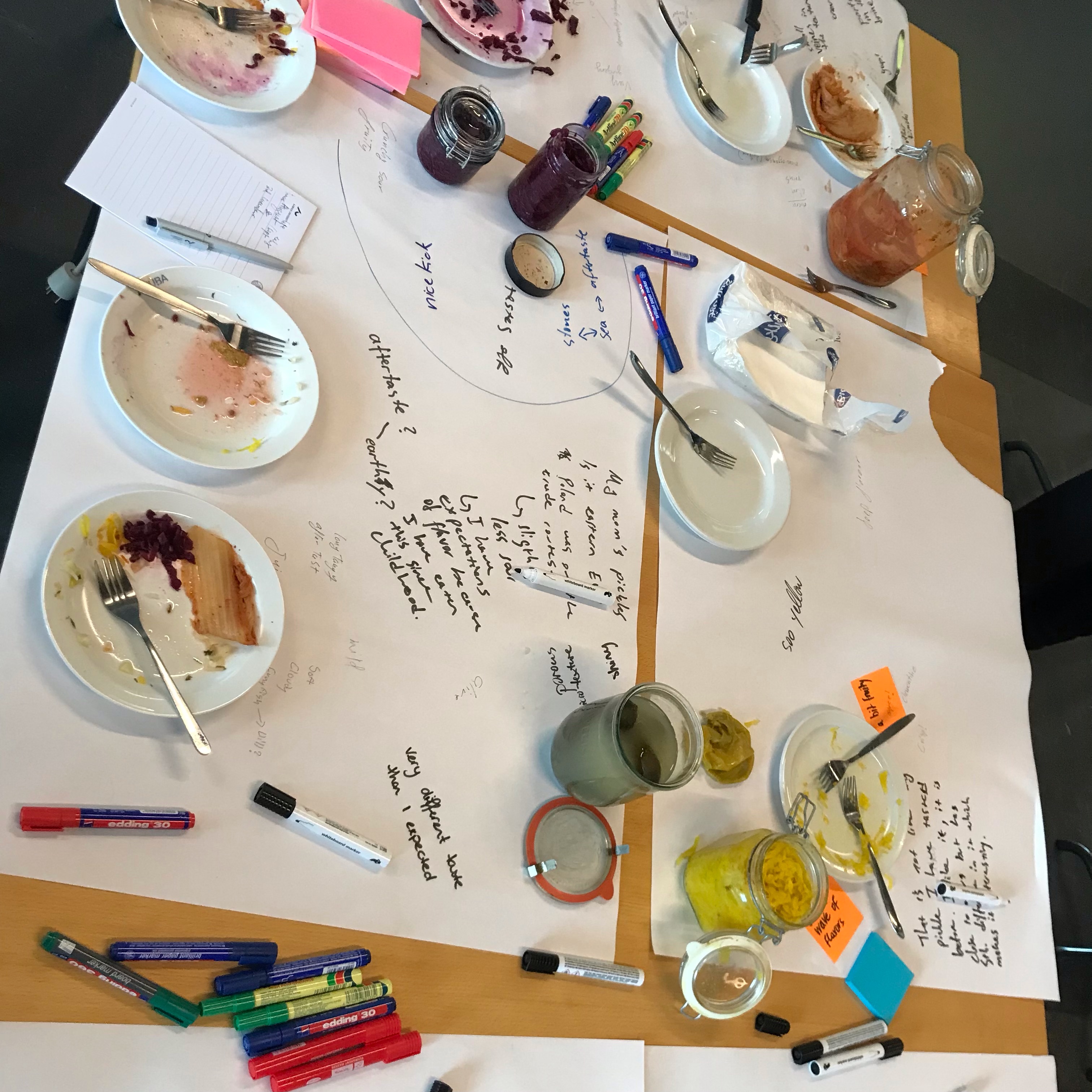 tasting table image with ferment jars and participant notes